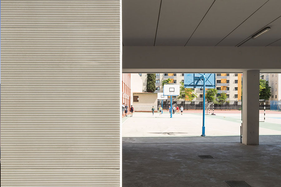 fachada en colegio con Cerramiento Artepref con acabado texturizado